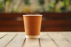 Steaming to-go coffee cup, the everyday habit behind most surface tooth staining