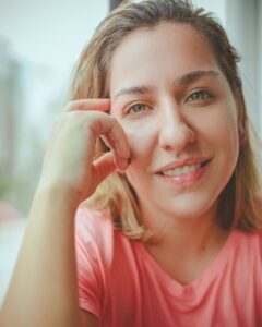 Woman with a bright, healthy smile after whitening without enamel damage