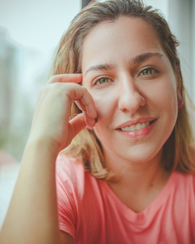 Woman with a bright, healthy smile after whitening without enamel damage