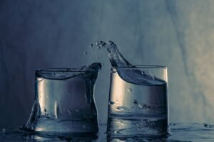 Glasses of water splashing