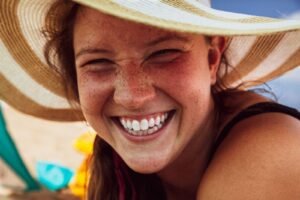 Person smiling outdoors with white teeth